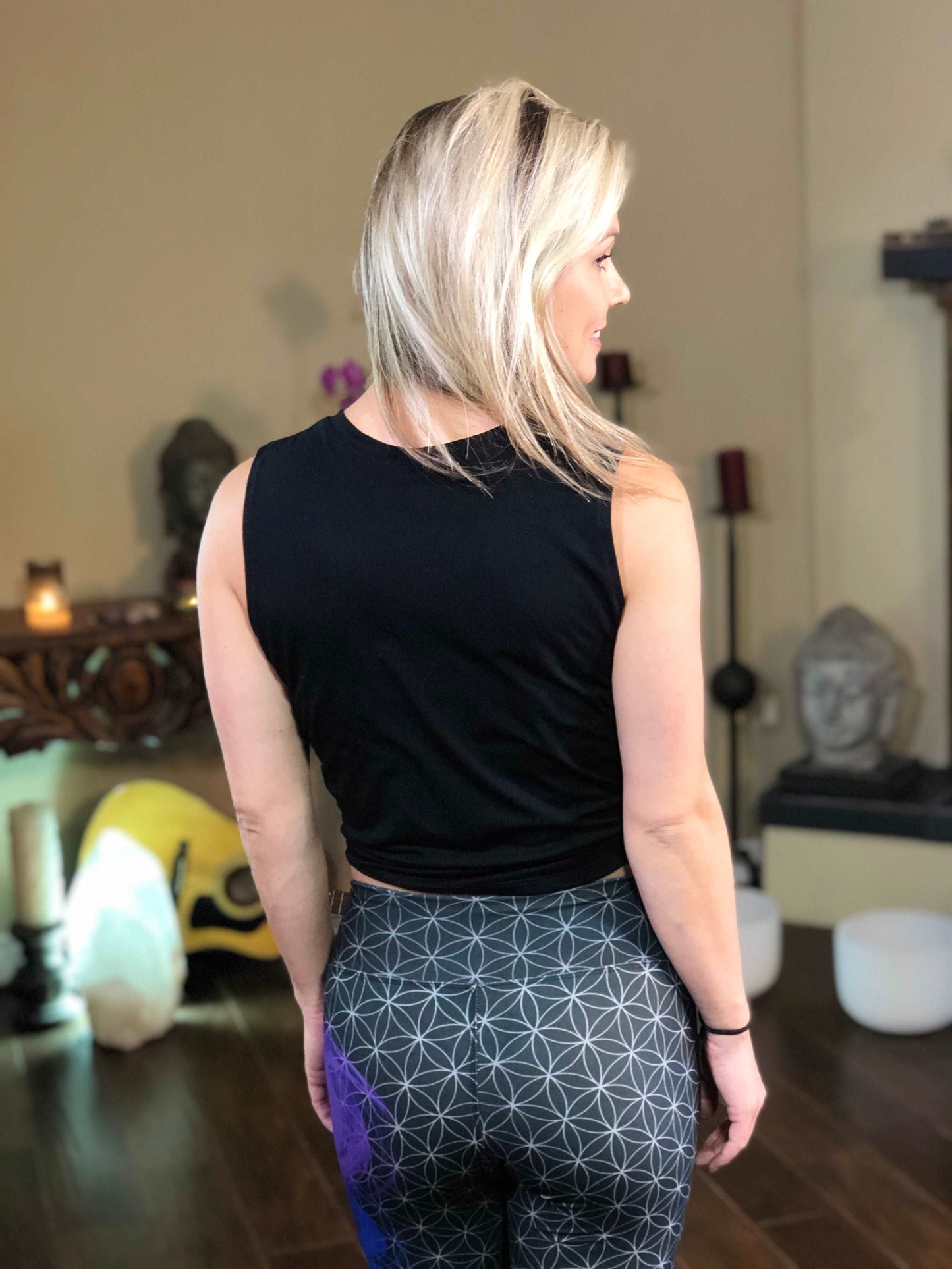 Woman wearing black tie-front tank top