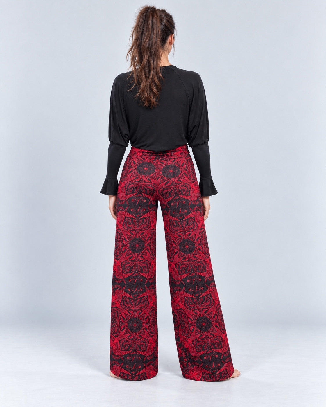 Red Swallow Lounge Pant back view, styled with a black shrug.