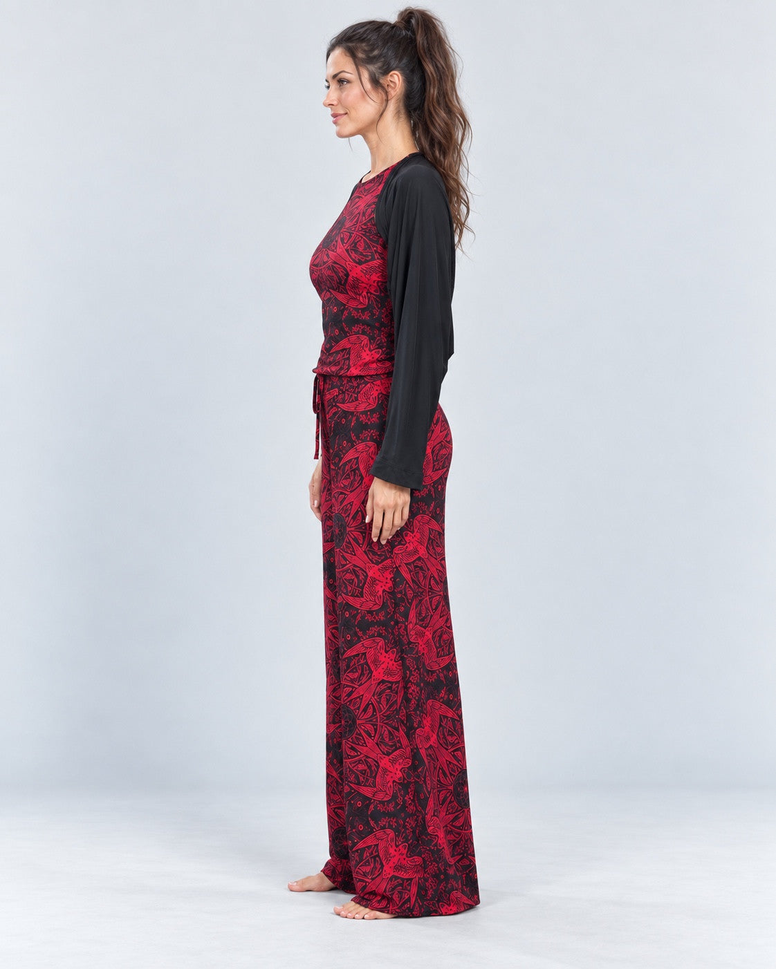 Red Swallow Lounge Pant side view, styled with the printed tank and black shrug.